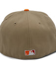 A fitted hat with the San Diego Padres logo, featuring a two-tone kakhi and orange design with a red under visor.