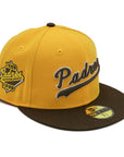 A fitted hat with the San Diego Padres logo, featuring a two-tone brown and yellow design with a green under visor.