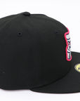 Black baseball cap with a brand logo on a white background