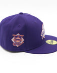 A purple fitted hat with metallic patches featuring the San Diego Padres logo.