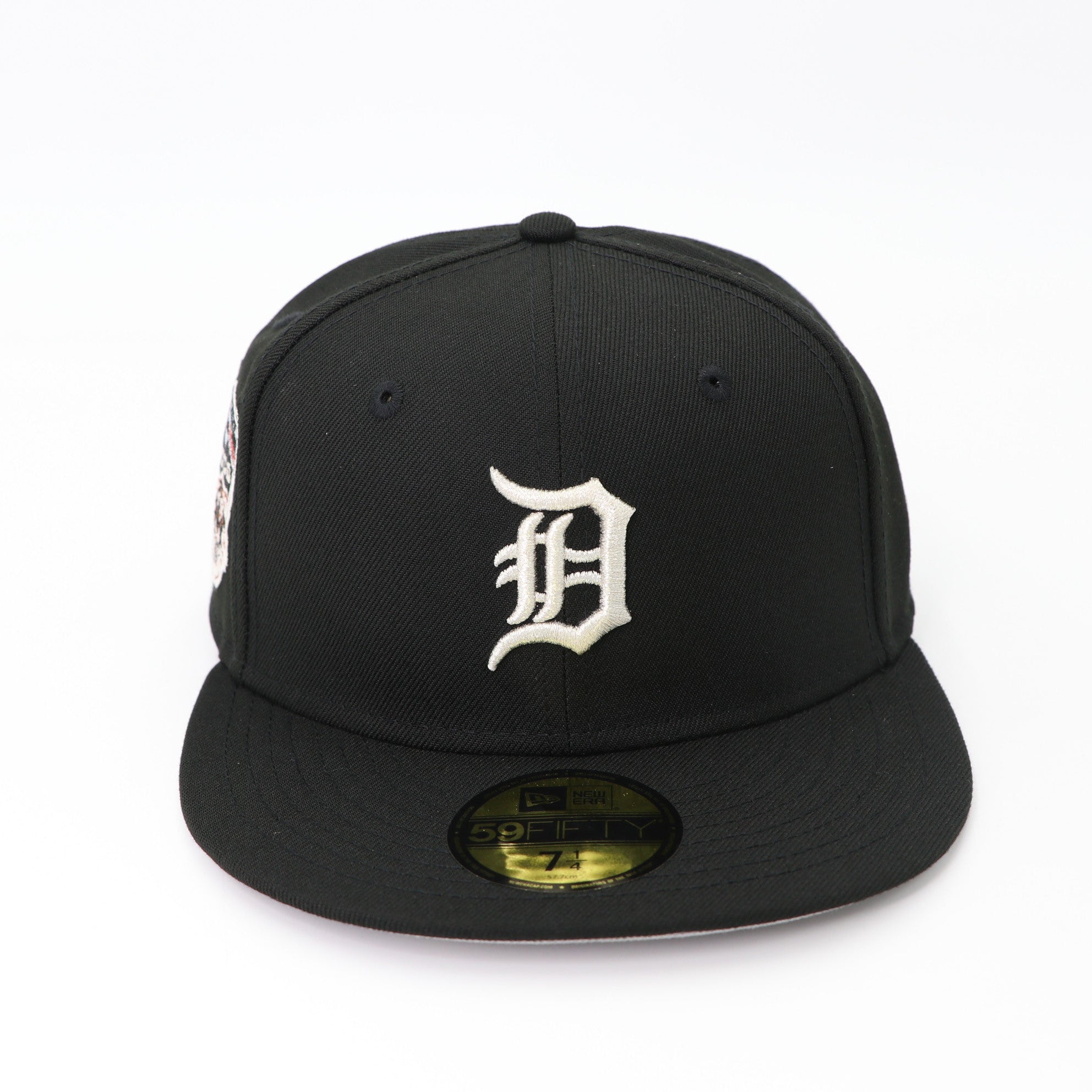 Black baseball cap with a white logo on a white background