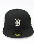 Black baseball cap with a white logo on a white background