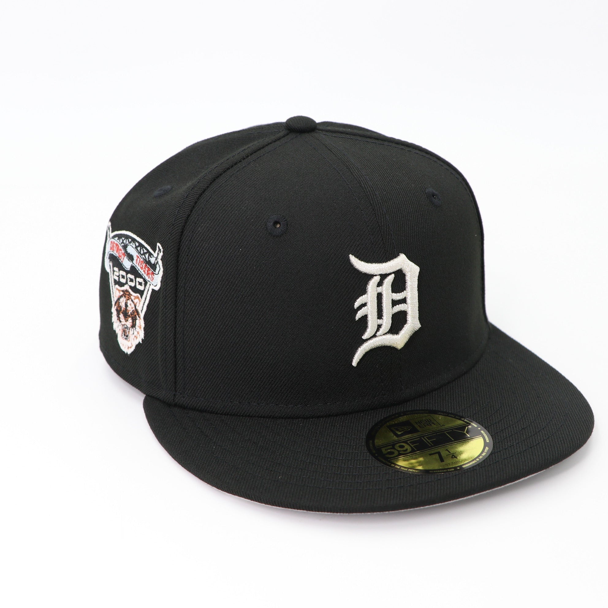 Black baseball cap with logo and patch on a white background