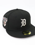 Black baseball cap with logo and patch on a white background