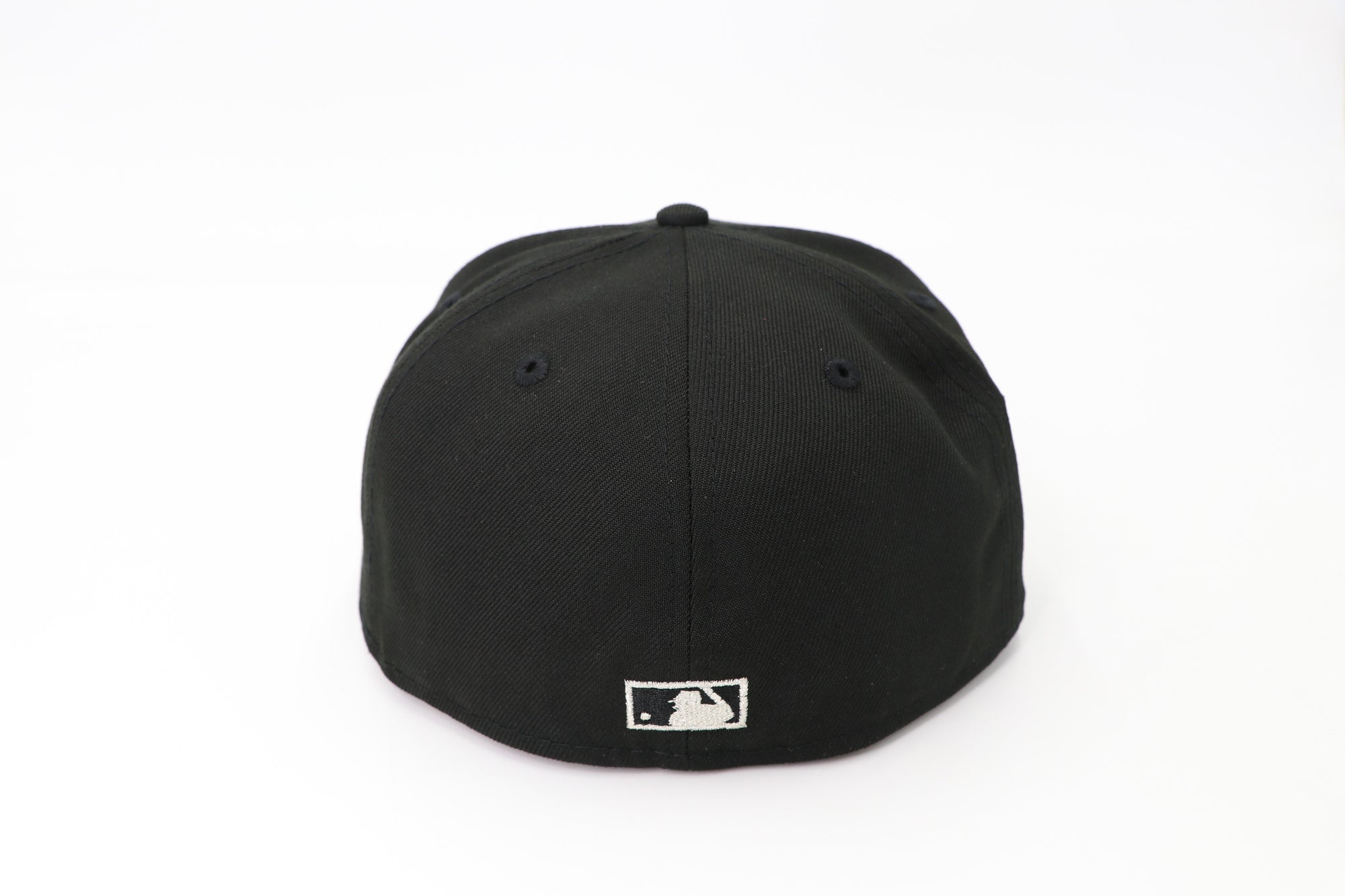 Black baseball cap with a logo on the back against a white background