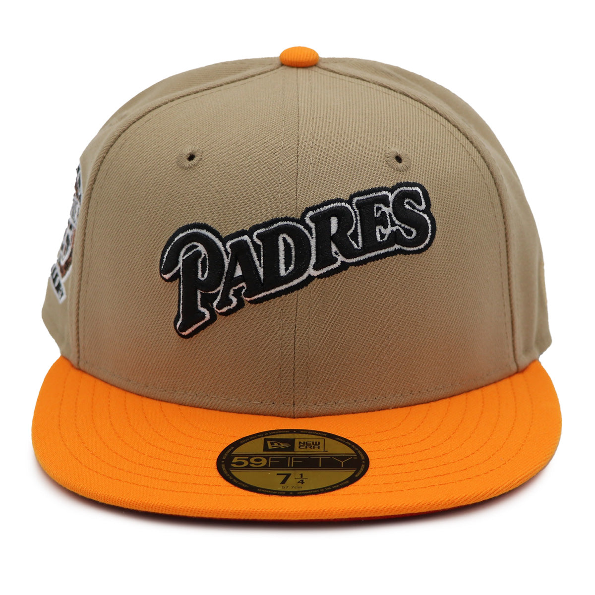 A fitted hat with the San Diego Padres logo, featuring a two-tone kakhi and orange design with a red under visor.