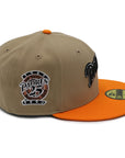 A fitted hat with the San Diego Padres logo, featuring a two-tone kakhi and orange design with a red under visor.