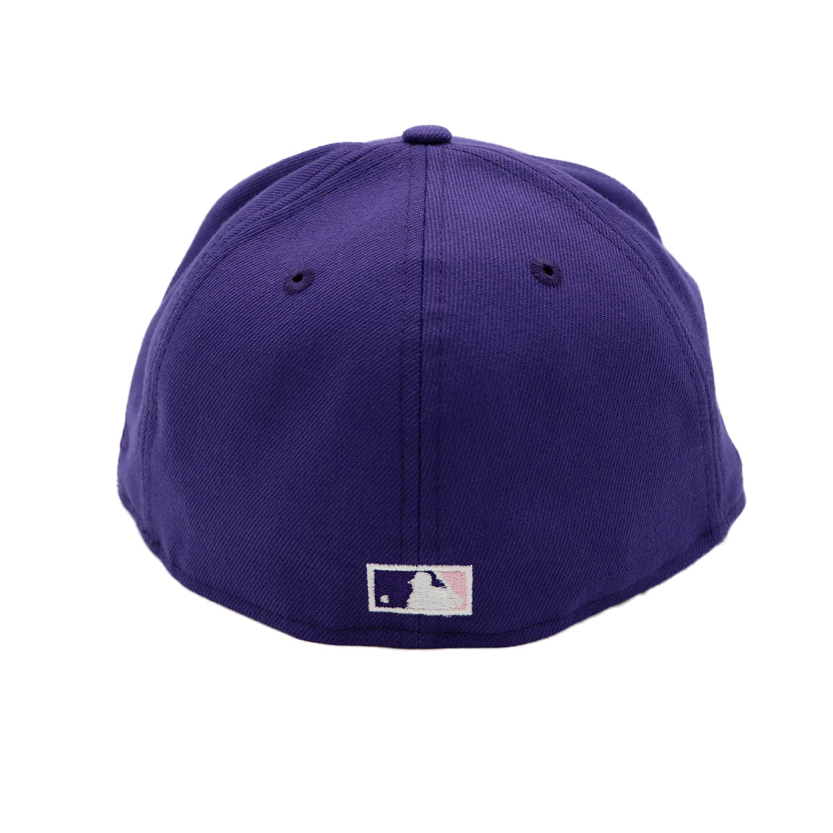 A 2-tone purple and black fitted hat with the San Diego Padres script logo, a 25th Anniversary side patch, and a pink under visor.