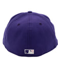 A 2-tone purple and black fitted hat with the San Diego Padres script logo, a 25th Anniversary side patch, and a pink under visor.
