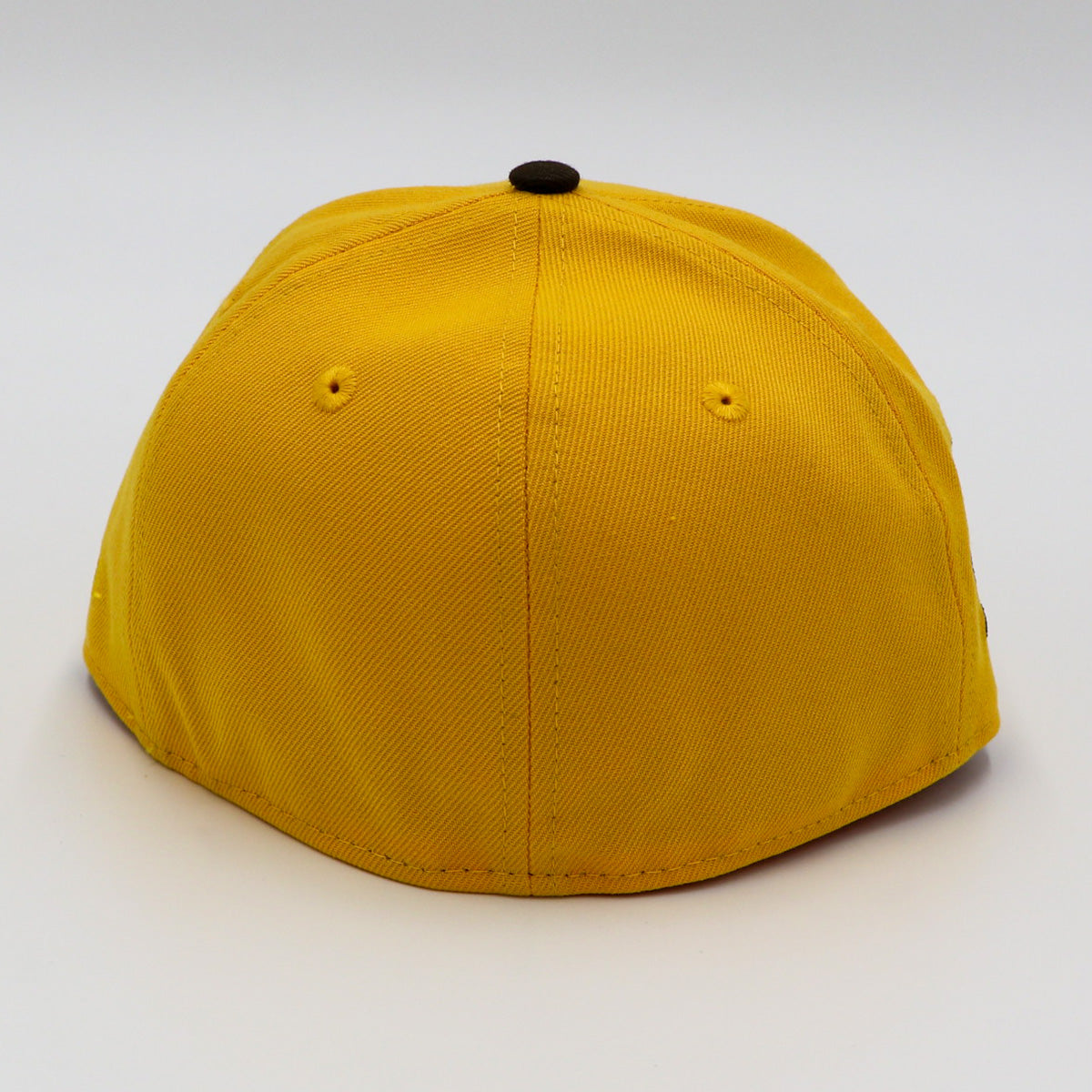 A fitted hat with the San Diego Padres logo, featuring a two-tone brown and yellow design with a green under visor.