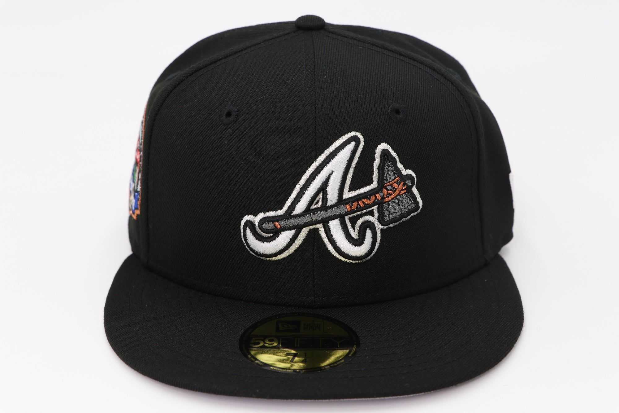 Black baseball cap with a logo on a white background