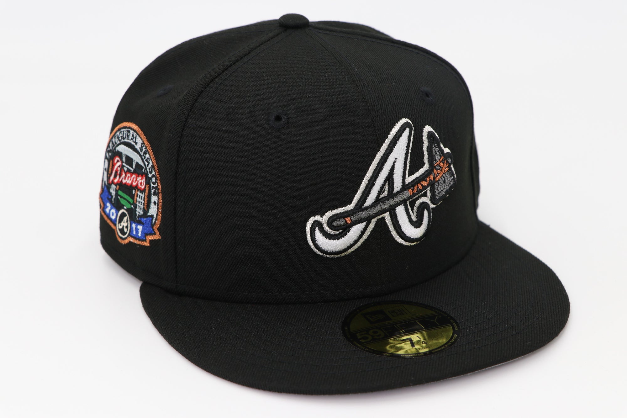 Black baseball cap with logos on a white background