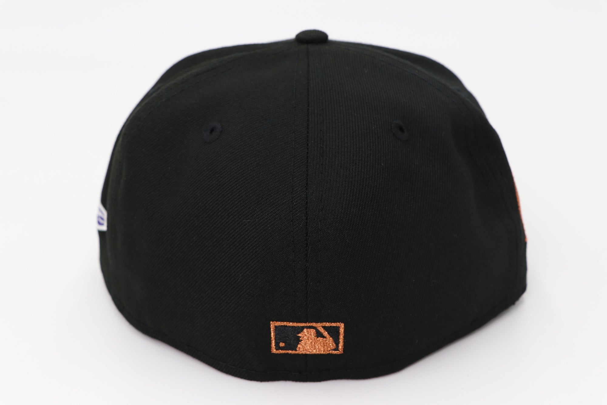 Black cap with a logo on the back against a white background