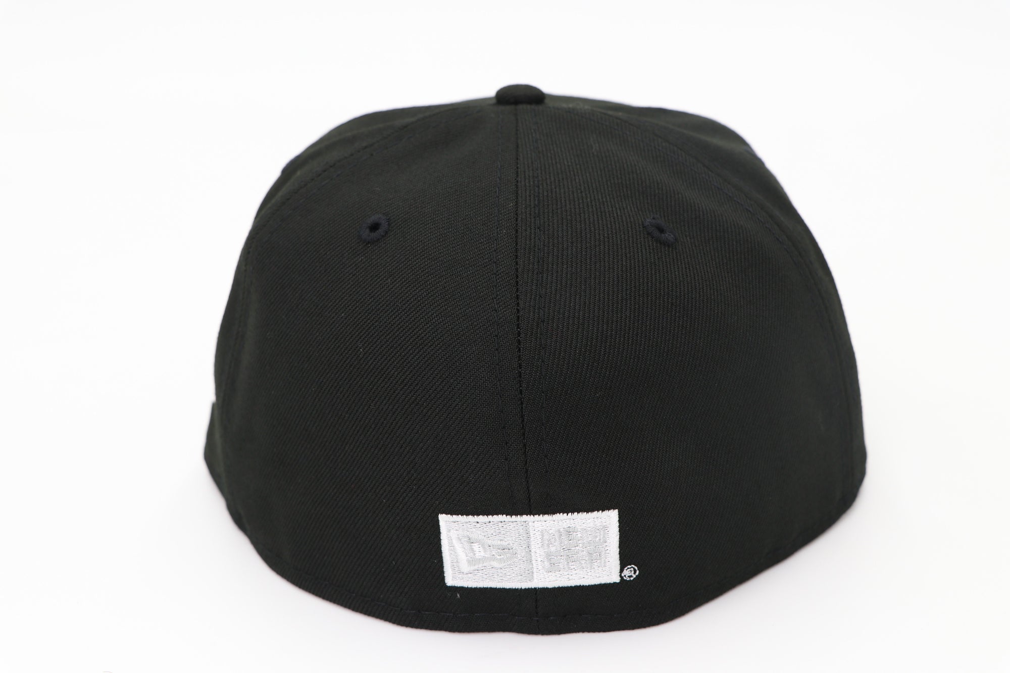 Black cap with a brand label on a white background