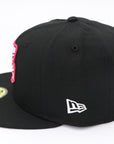 Black baseball cap with New Era logo on a white background