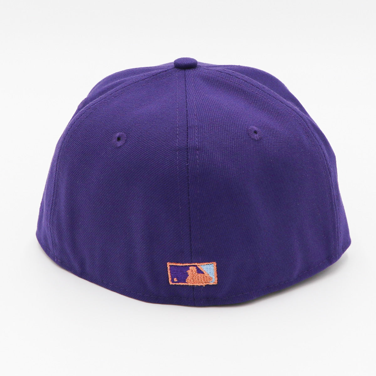 A purple fitted hat with metallic patches featuring the San Diego Padres logo.