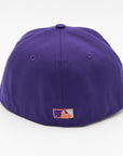 A purple fitted hat with metallic patches featuring the San Diego Padres logo.