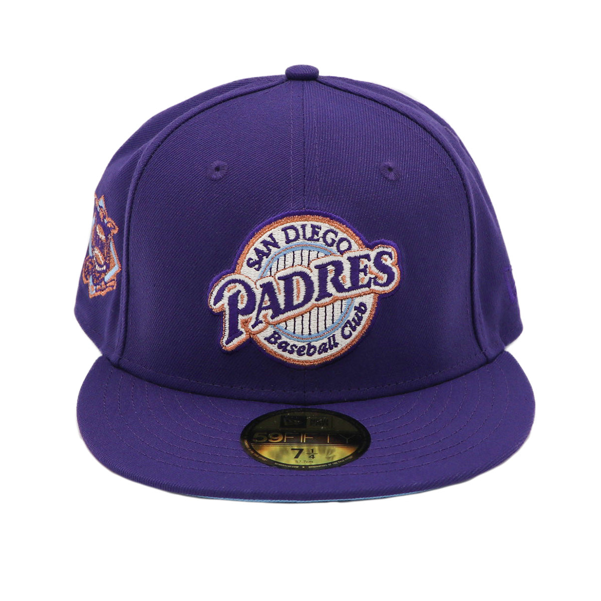 A purple fitted hat with metallic patches featuring the San Diego Padres logo.