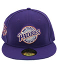 A purple fitted hat with metallic patches featuring the San Diego Padres logo.