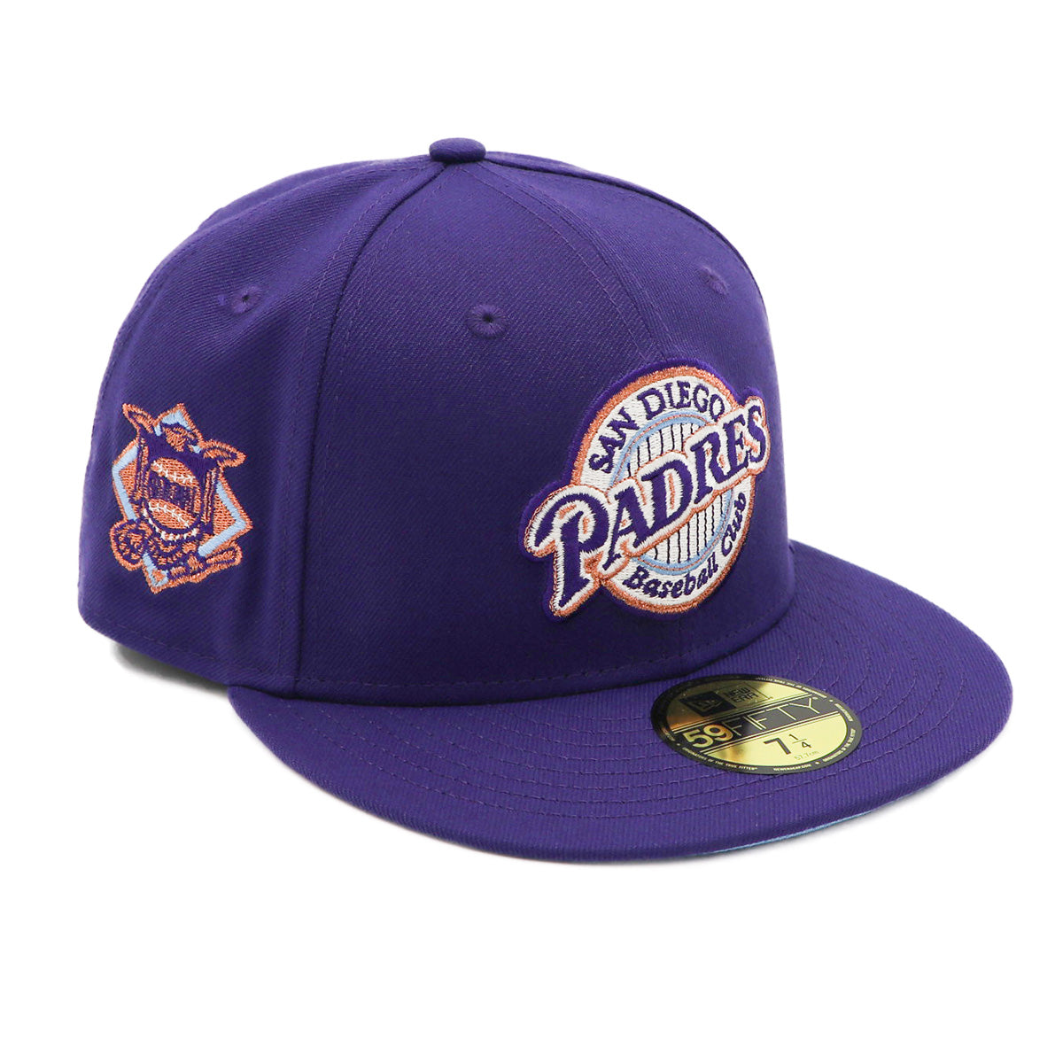 A purple fitted hat with metallic patches featuring the San Diego Padres logo.