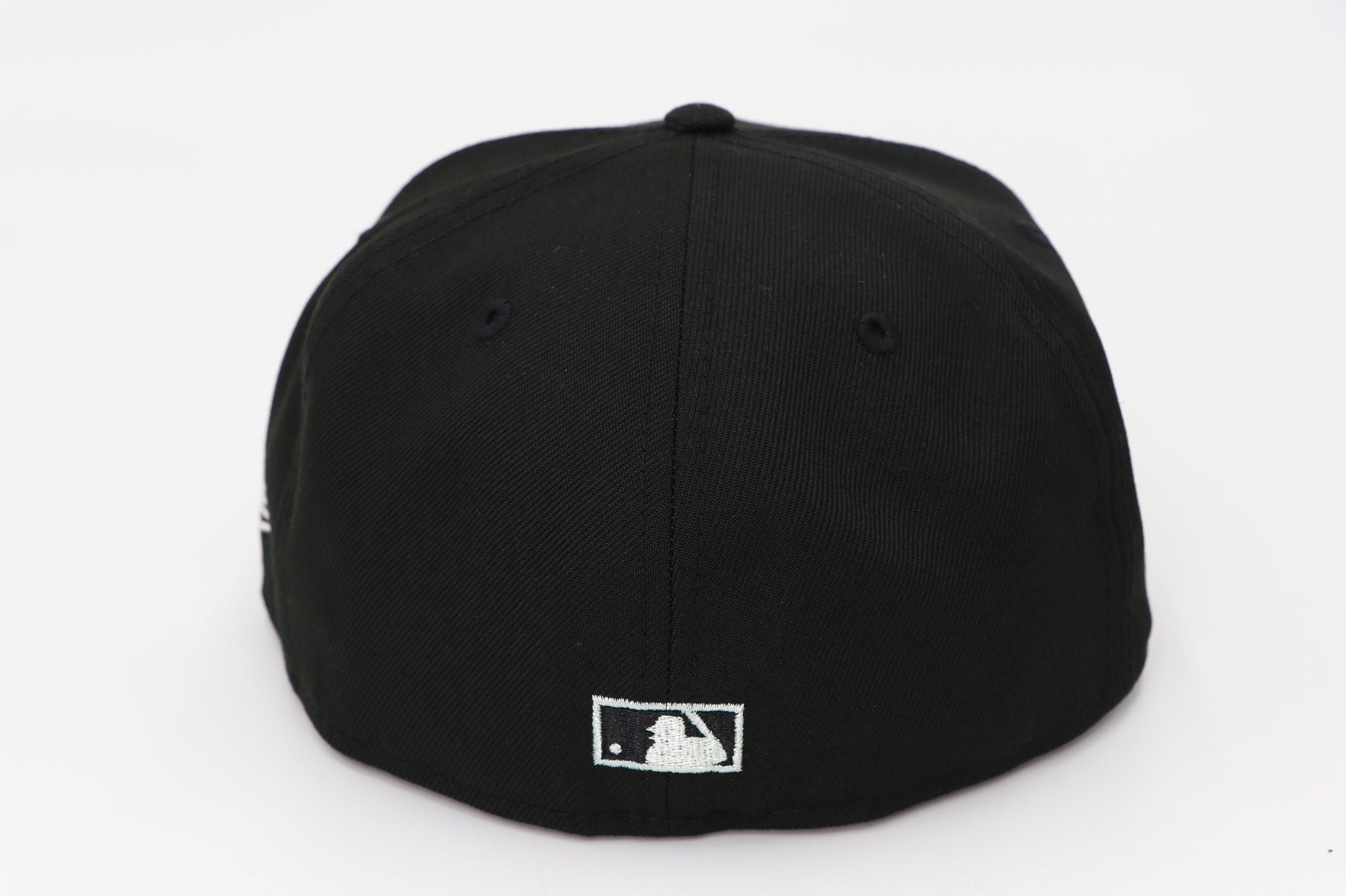 Black baseball cap with a logo on the back against a white background