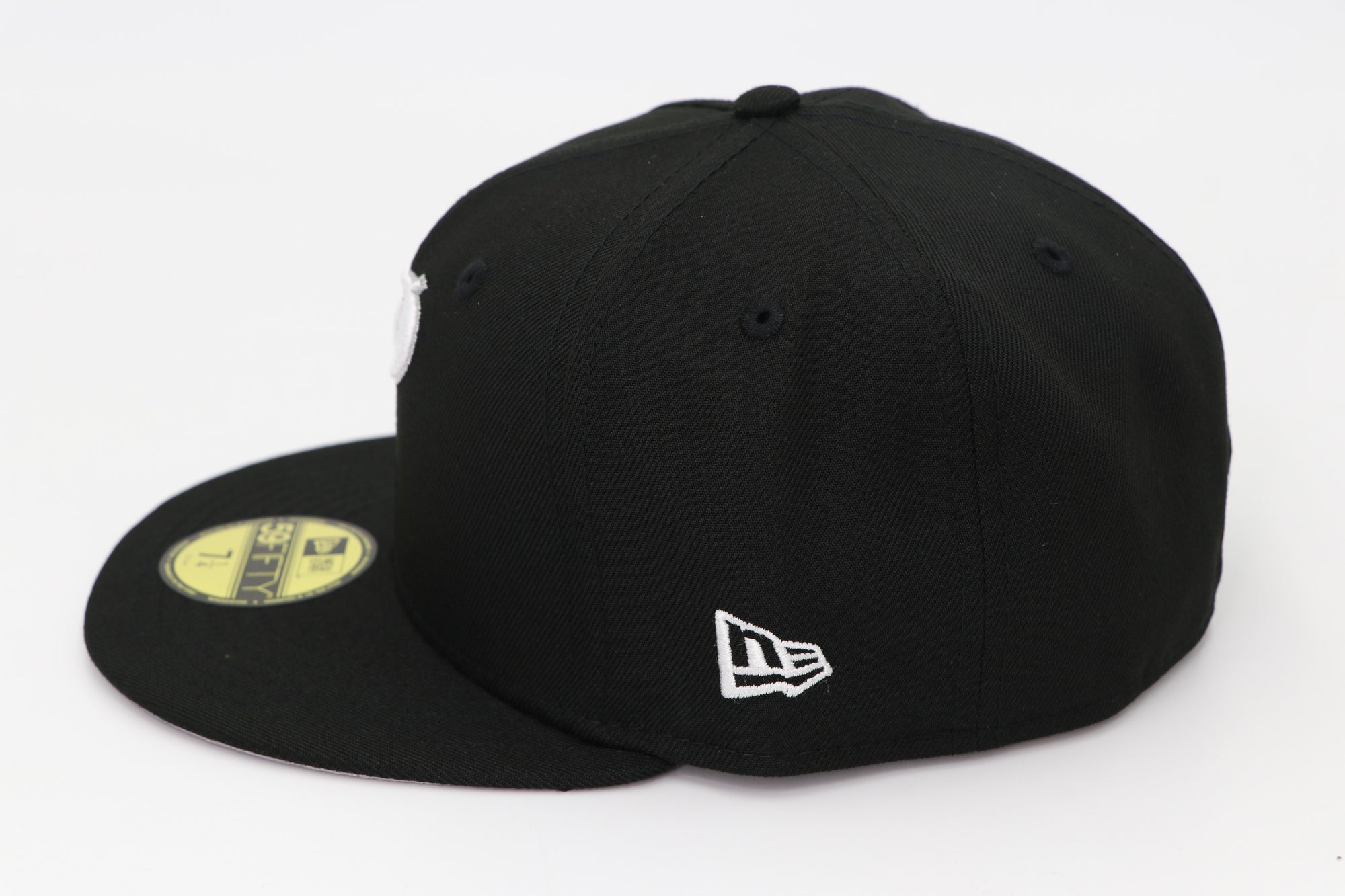 Black cap with New Era logo on a white background