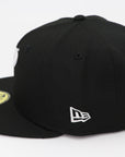 Black cap with New Era logo on a white background
