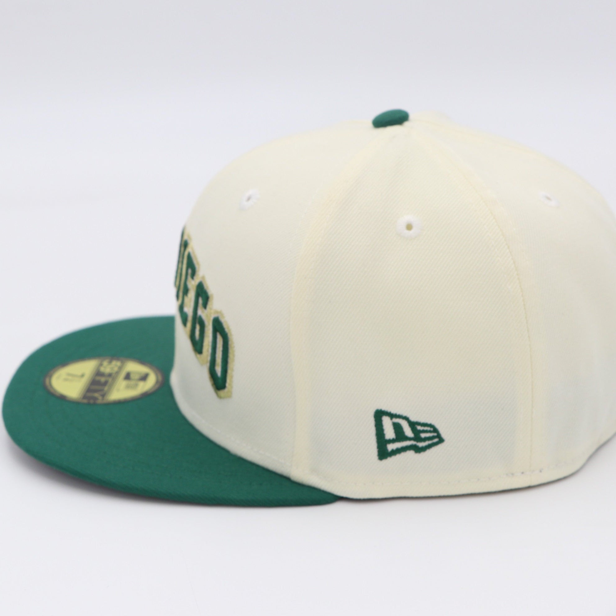 Baseball cap with green and beige colors on a white background